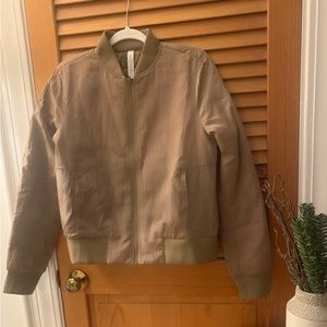 Never worn** Lululemon size 8, GOLD "Non-Stop Bomber Jacket Textured".